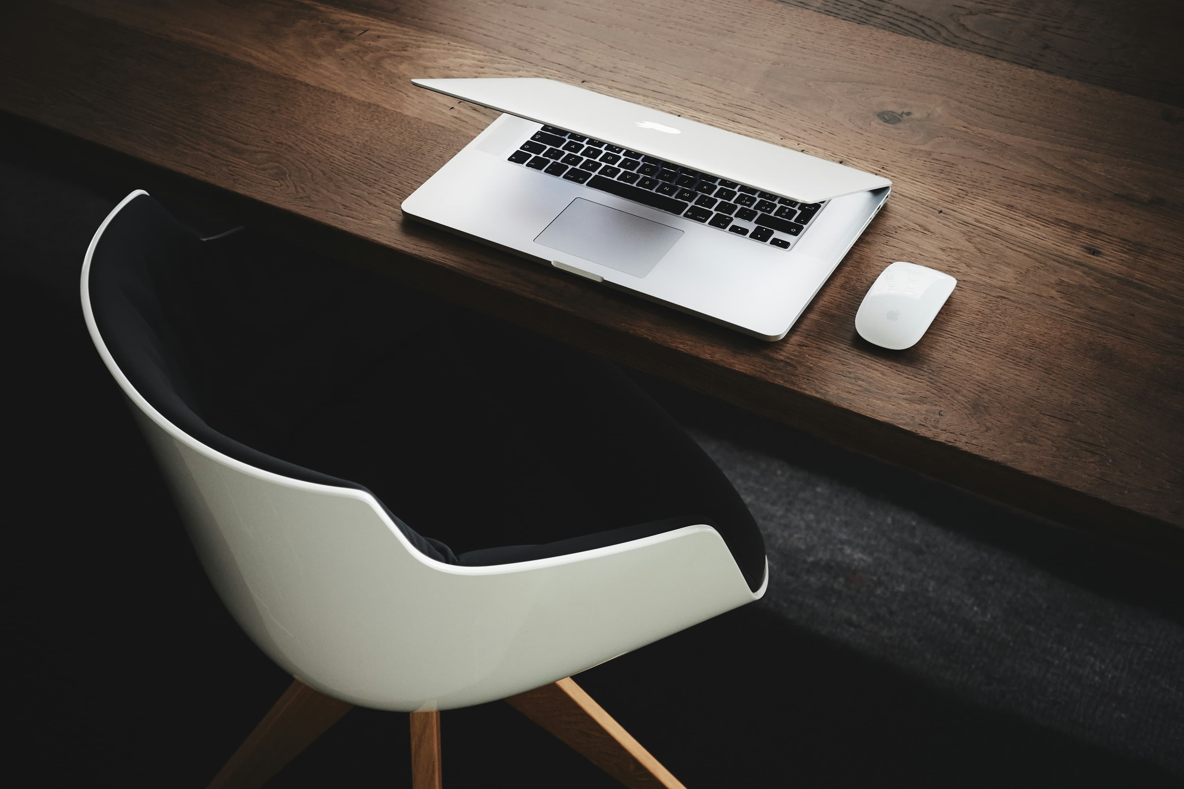 Workspace with laptop on wooden desk